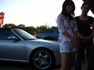 Fast car, Asian girls.  Idyllic scene?