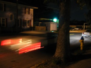 Joy's car, which has a name, driving off.